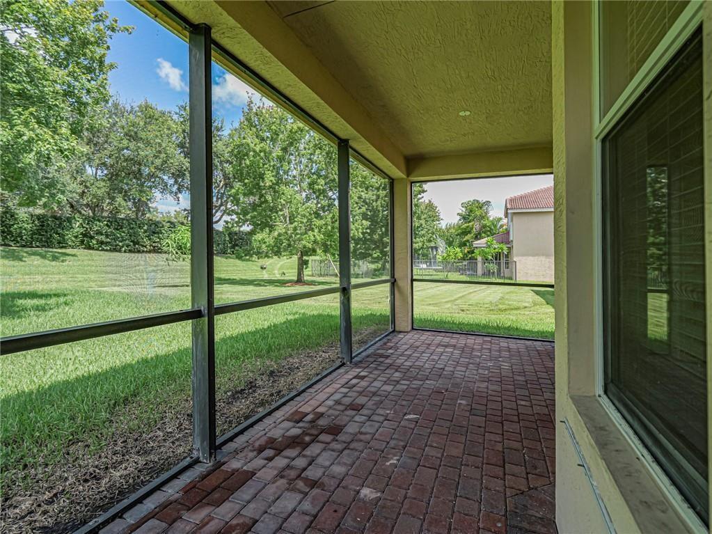 1931 Grey Falcon Circle Southwest Vero Beach, FL 32962 - Photo 25 of 36 a view of a room with porch and a yard