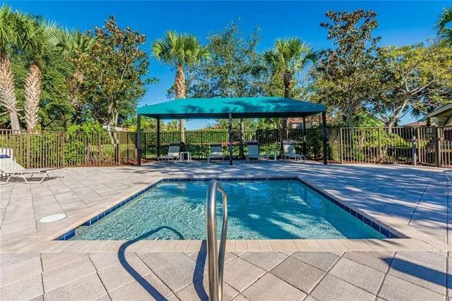 a view of swimming pool with a patio
