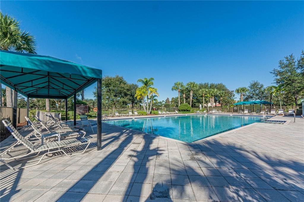 1931 Grey Falcon Circle Southwest Vero Beach, FL 32962 - Photo 30 of 36 a view of swimming pool with a patio