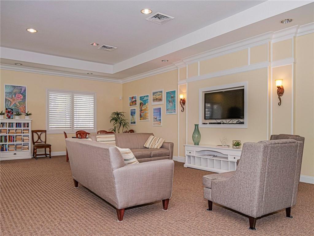 1931 Grey Falcon Circle Southwest Vero Beach, FL 32962 - Photo 34 of 36 a living room with furniture and a flat screen tv