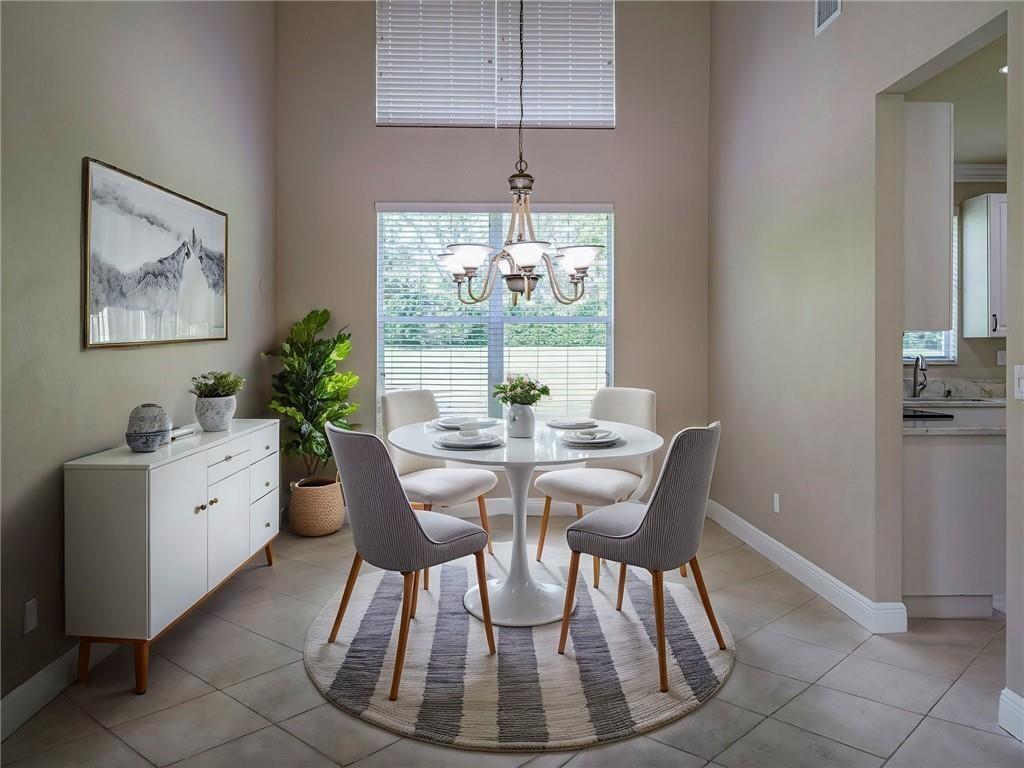 1931 Grey Falcon Circle Southwest Vero Beach, FL 32962 - Photo 6 of 36 a view of a dining room with furniture window and outside view
