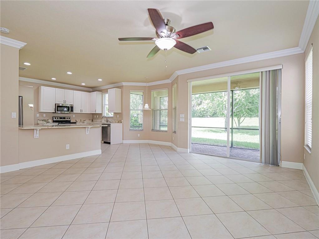 1931 Grey Falcon Circle Southwest Vero Beach, FL 32962 - Photo 10 of 36 a view of an empty room with kitchen view and a window