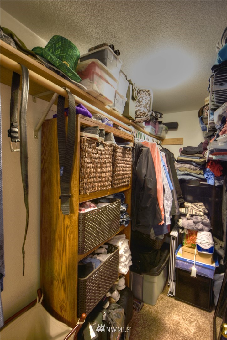 5423 187th Court Southwest Rochester, WA 98579 - Photo 14 of 24 a view of walk in closet with clothes and shoes
