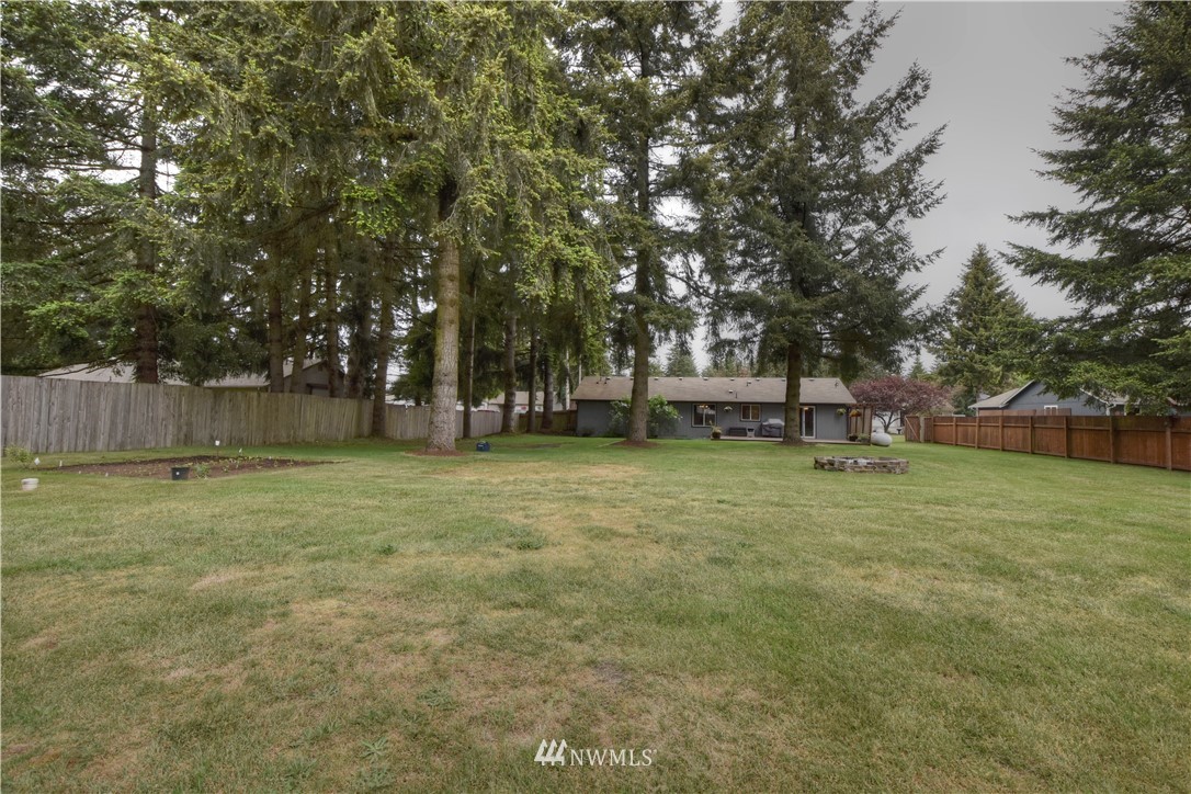 5423 187th Court Southwest Rochester, WA 98579 - Photo 22 of 24 a view of outdoor space with deck and yard