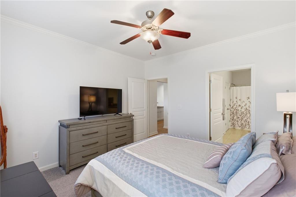 10 Perimeter Summit Boulevard, Unit 4439 Atlanta, GA 30319 - Photo 18 of 69 a bedroom with a bed and a flat screen tv