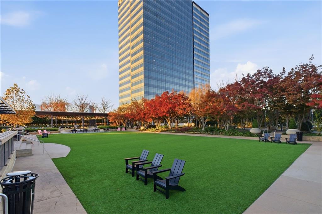10 Perimeter Summit Boulevard, Unit 4439 Atlanta, GA 30319 - Photo 32 of 69 a view of a chair and table on the garden