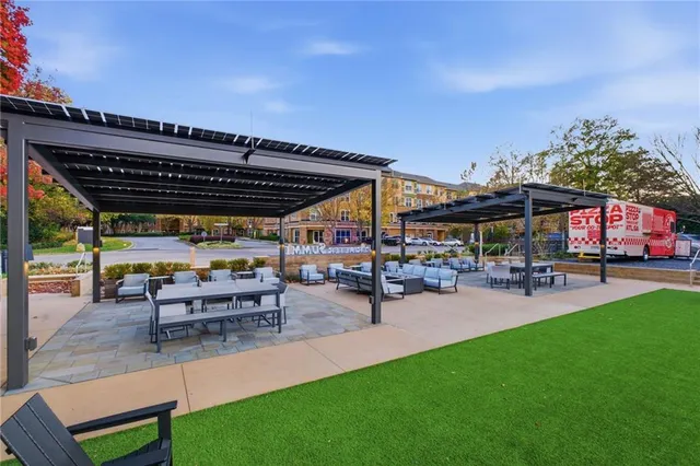 a view of a building with sitting area