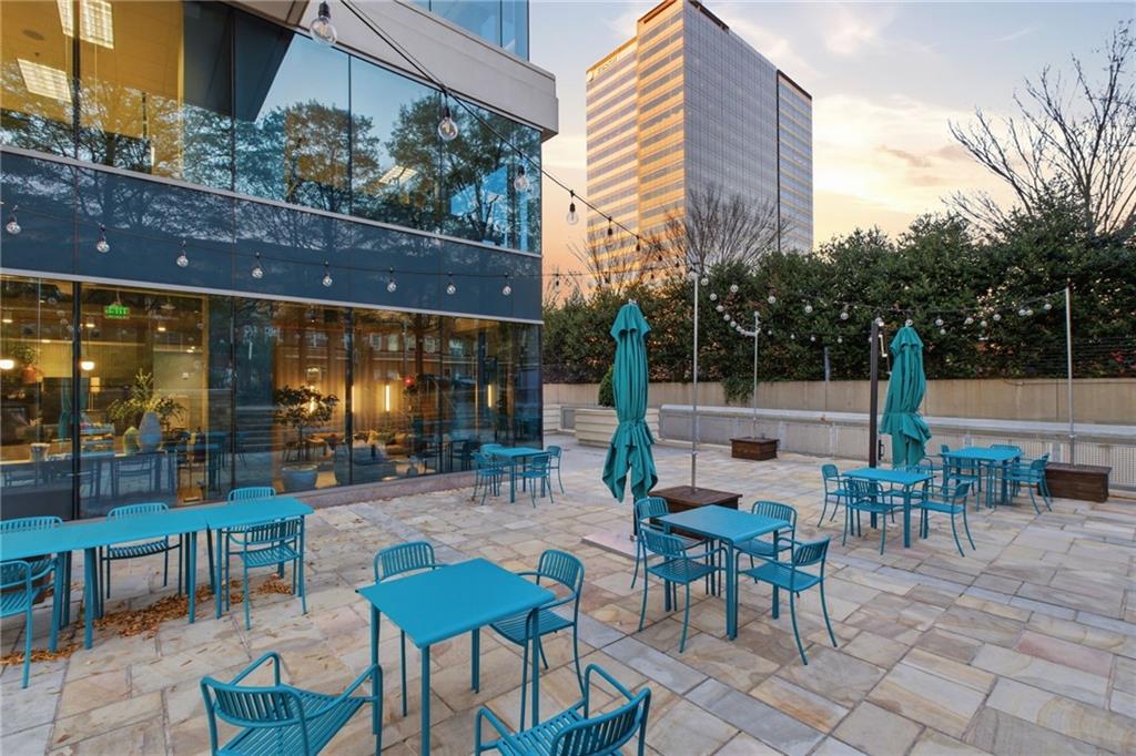 10 Perimeter Summit Boulevard, Unit 4439 Atlanta, GA 30319 - Photo 45 of 69 a view of a patio with table and chairs and potted plants