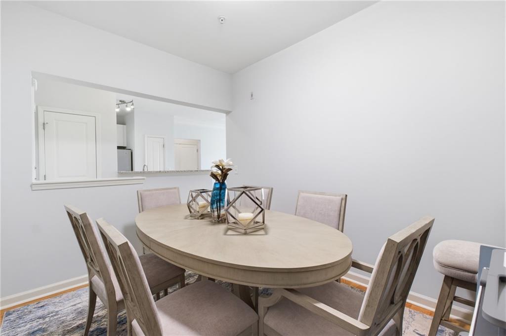 10 Perimeter Summit Boulevard, Unit 4439 Atlanta, GA 30319 - Photo 10 of 69 a view of a dining room with furniture and wooden floor