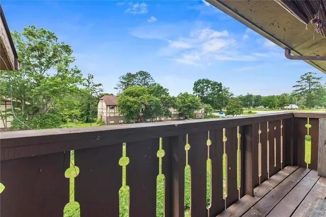a balcony with wooden floor