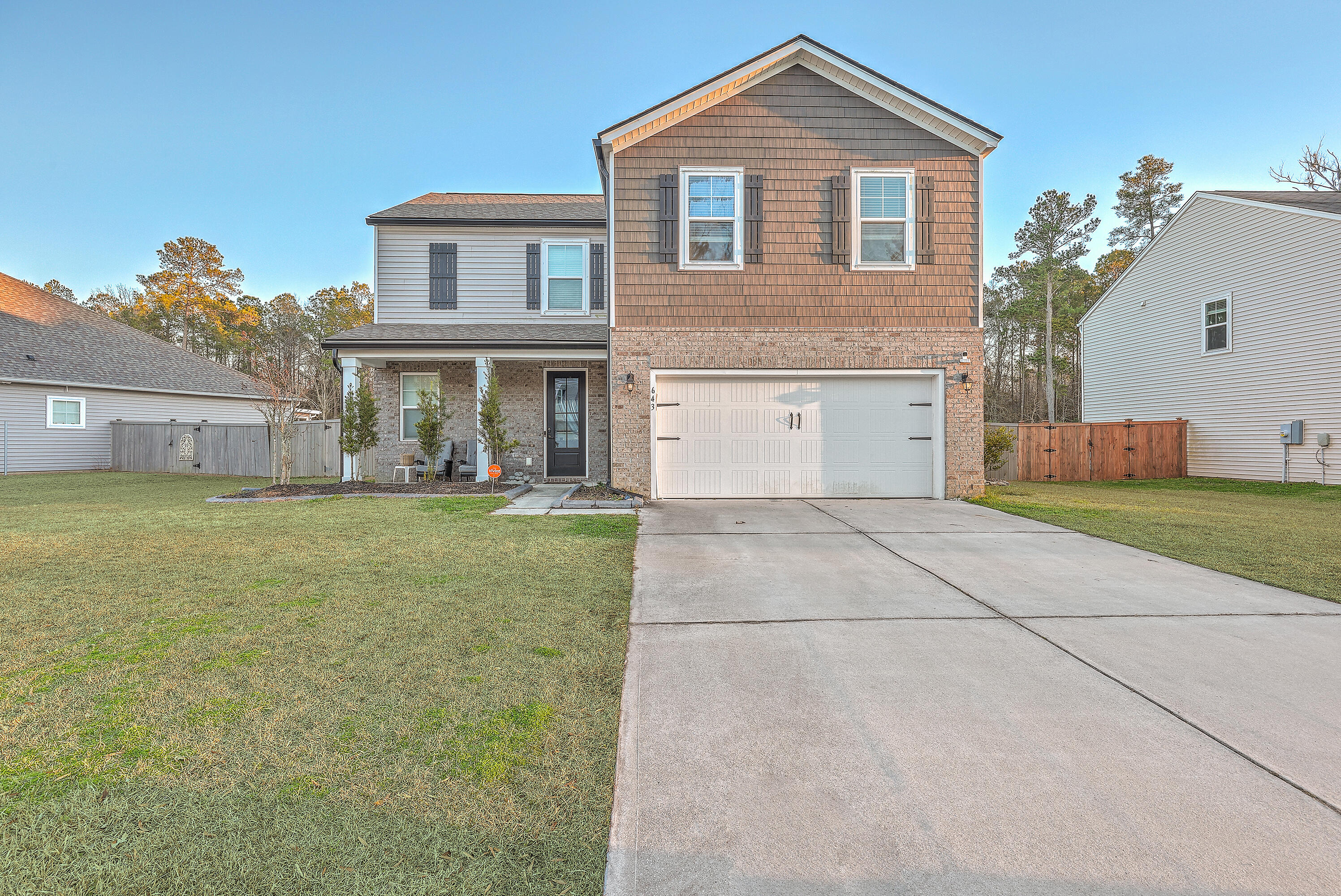 Front of home with oversized driveway