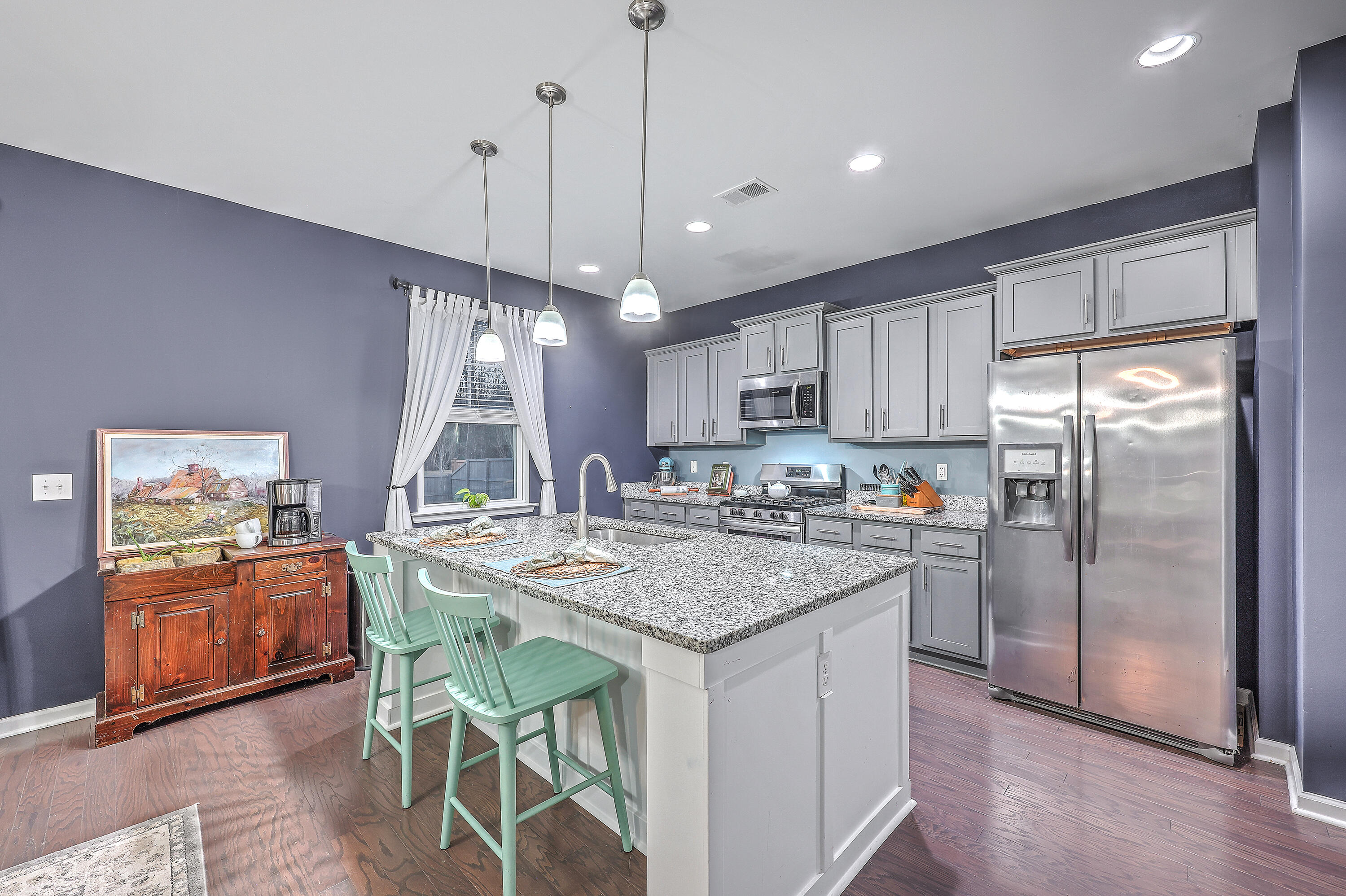 643 Woolum Drive Moncks Corner, SC 29461 - Photo 9 of 29 Kitchen with Island and Pantry