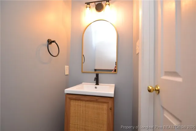 a bathroom with a sink and mirror
