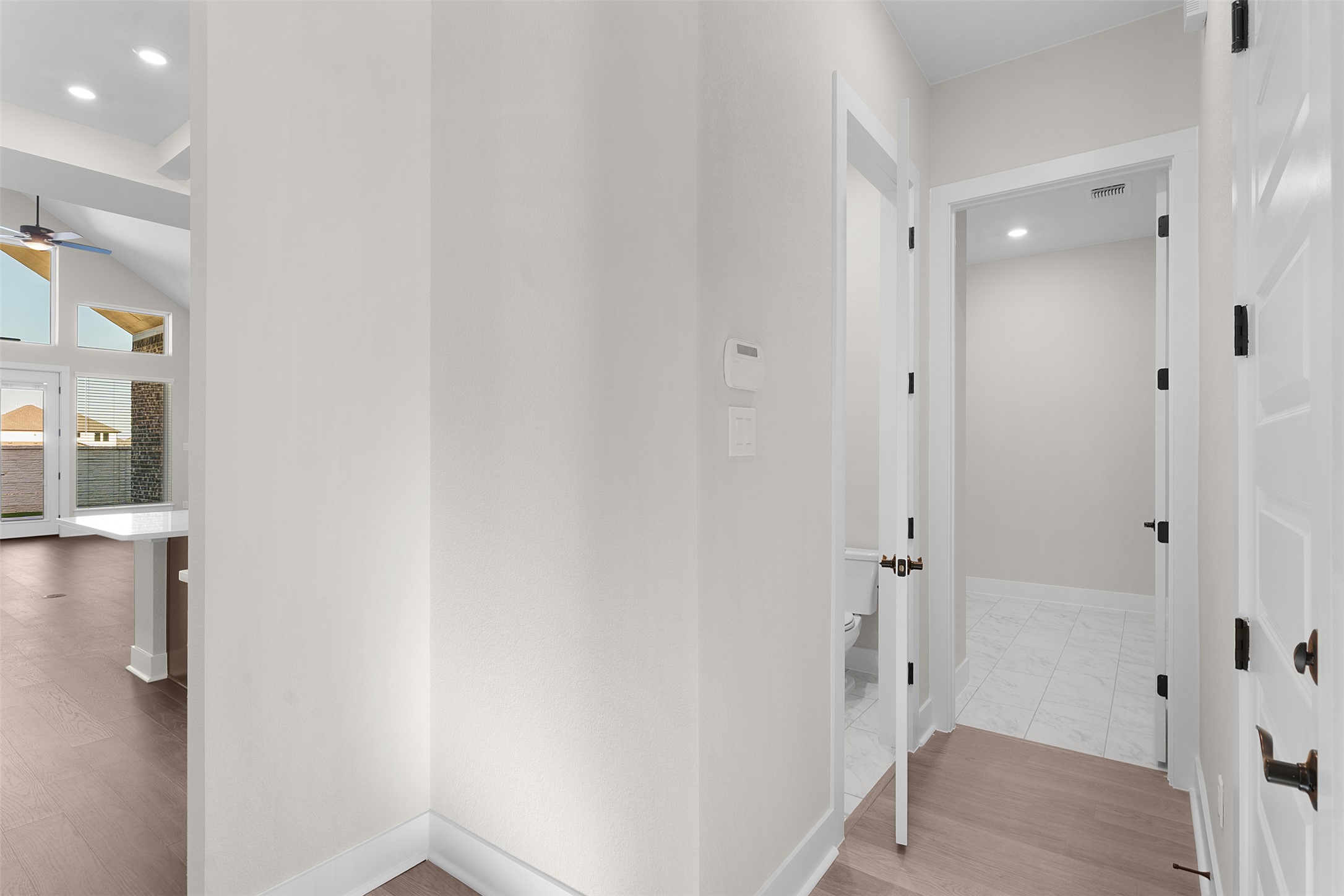 17216 Hope Bergman Road Pflugerville, TX 78660 - Photo 4 of 30 Hallway with light wood-style floors and recessed lighting