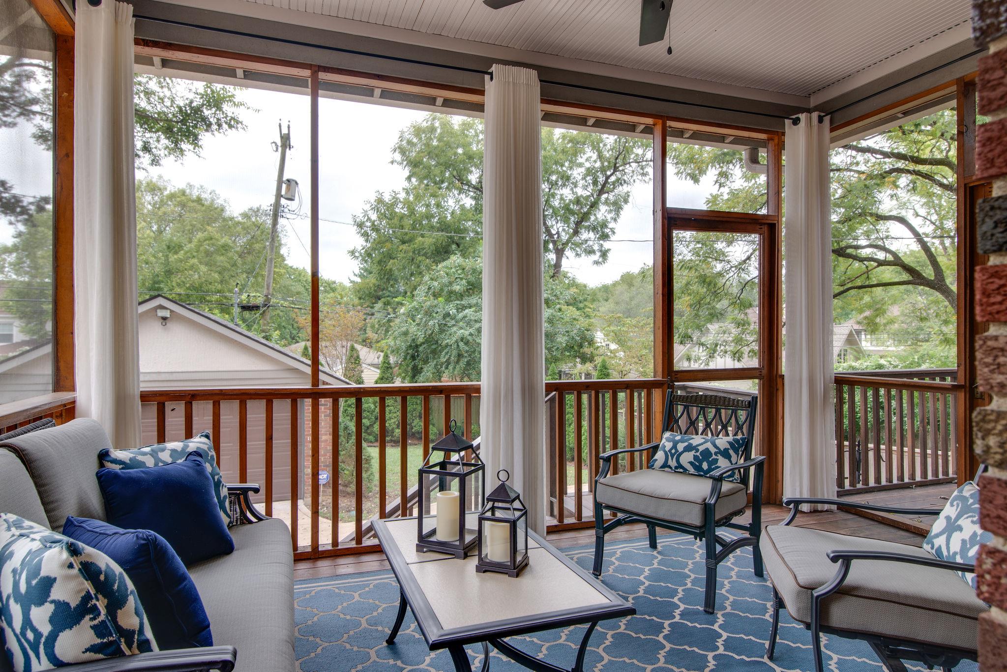 113 Mockingbird Road Nashville, TN 37205 - Photo 14 of 30 a balcony filled with furniture and floor to ceiling windows