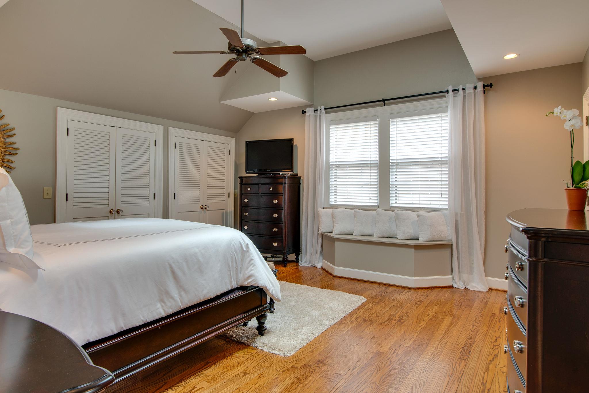 113 Mockingbird Road Nashville, TN 37205 - Photo 21 of 30 a bedroom with a bed dresser and a window