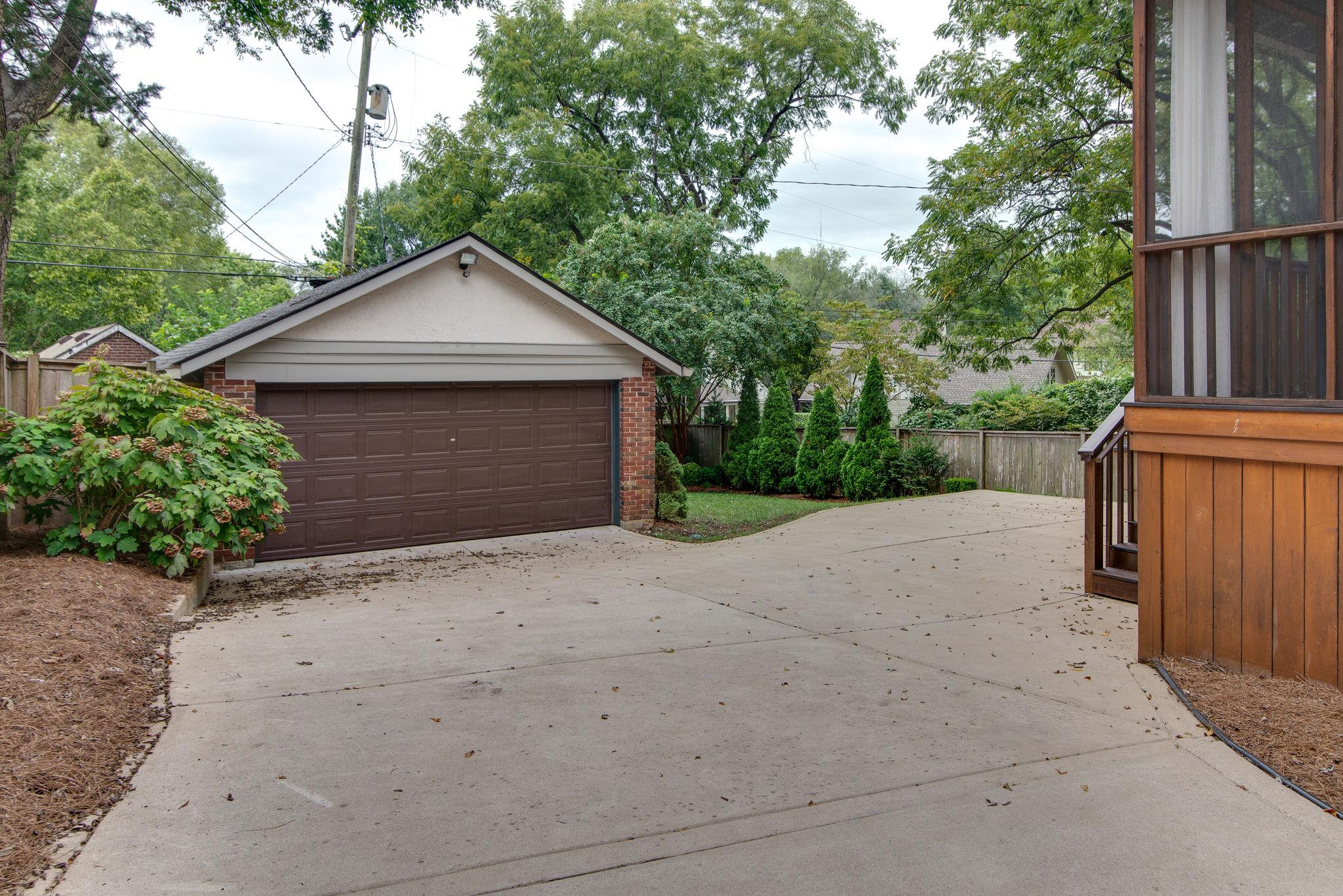 113 Mockingbird Road Nashville, TN 37205 - Photo 29 of 30 a front view of house with yard garage and green space