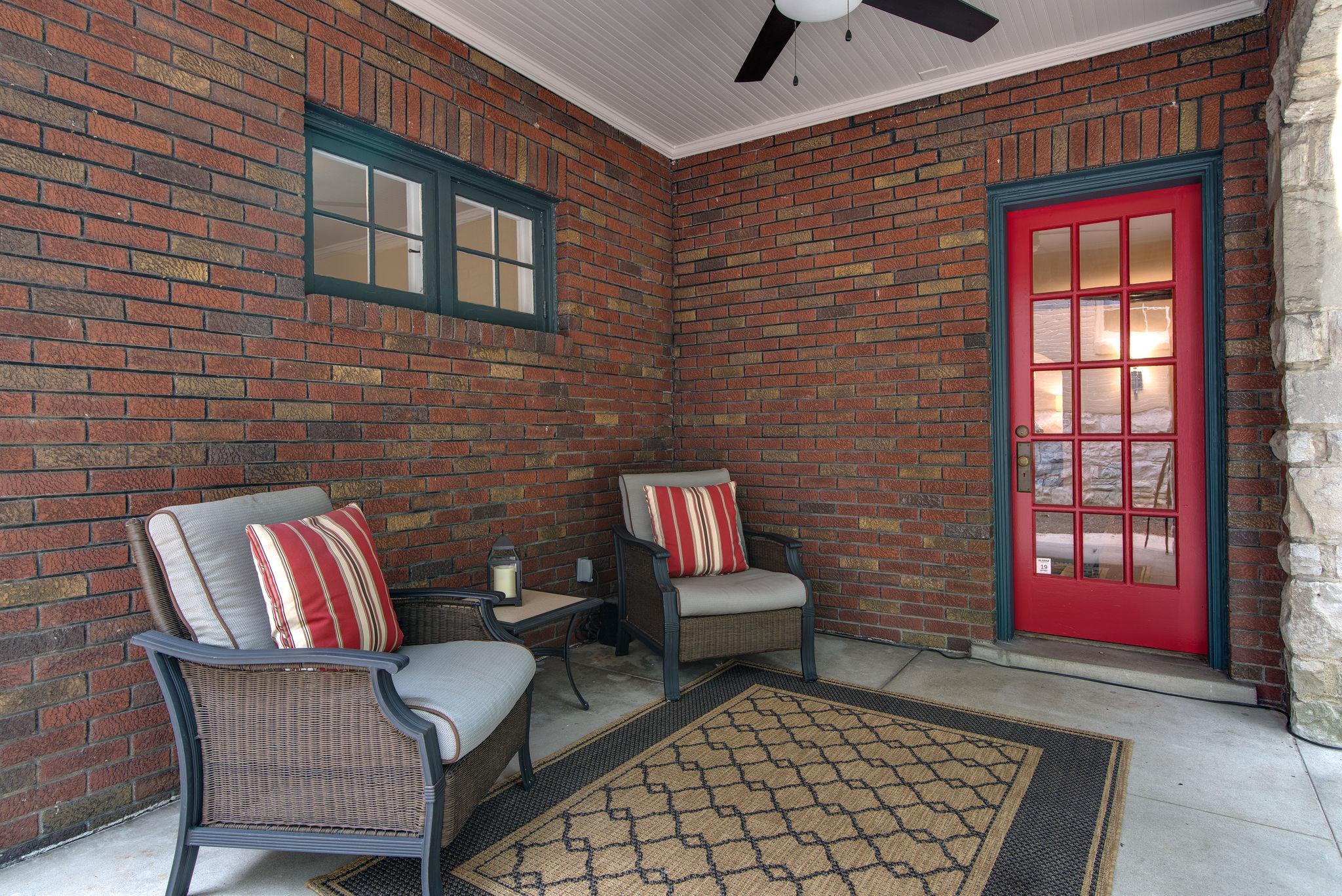 113 Mockingbird Road Nashville, TN 37205 - Photo 3 of 30 a outdoor living space with furniture and a rug