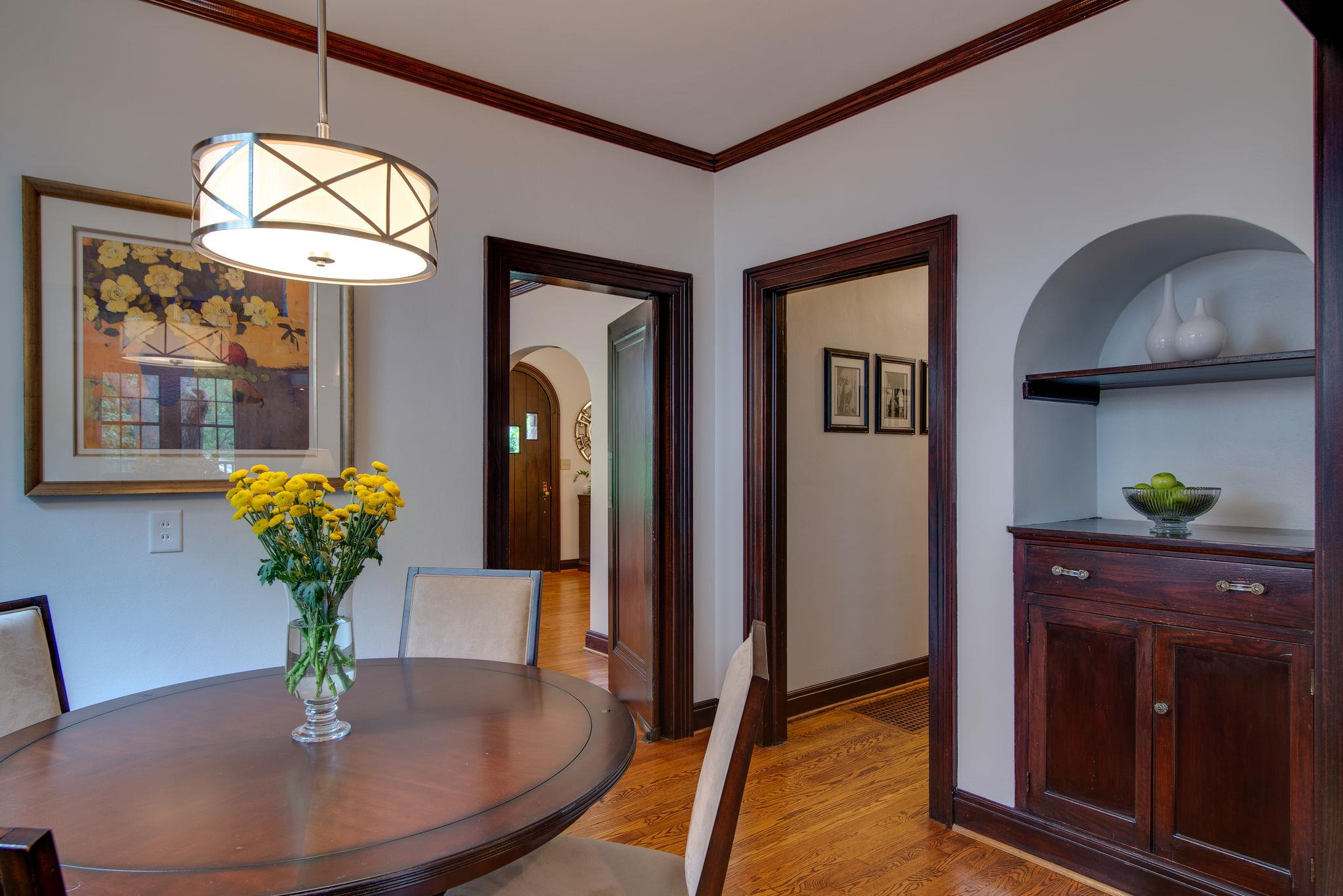 113 Mockingbird Road Nashville, TN 37205 - Photo 9 of 30 a view of a dining room with furniture wooden floor and chandelier