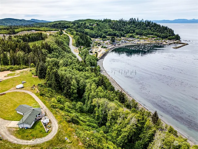 a view of a swimming pool with a lake and mountain in the back