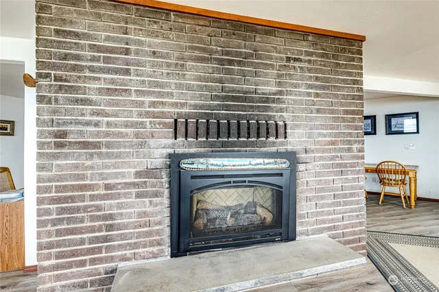 a view of a room with wooden floor and window