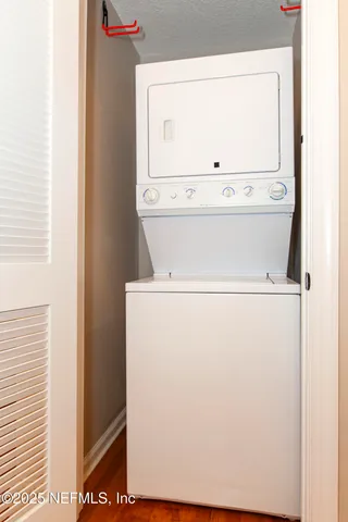 view of hall way with furniture and wooden floor