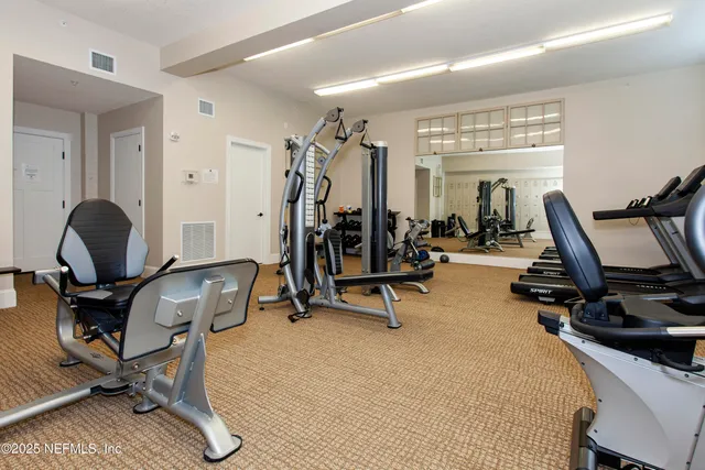 an aerial view of a house with a garden and trees