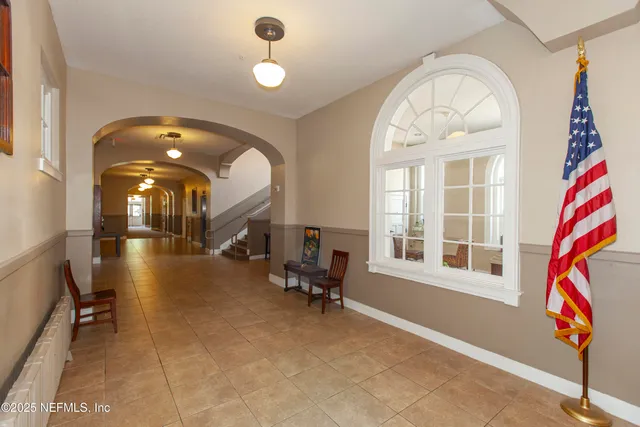 a view of a livingroom with furniture gym equipment