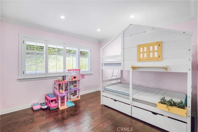 a bathroom with a double vanity sink a mirror and shower