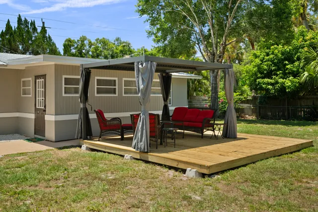 a view of a garden with a house