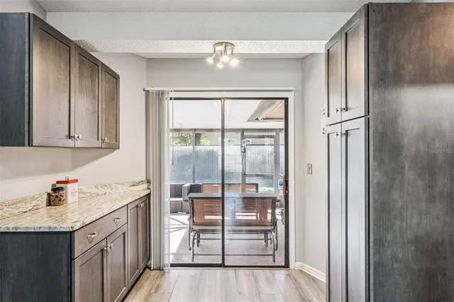 a kitchen with stainless steel appliances granite countertop a stove and a microwave
