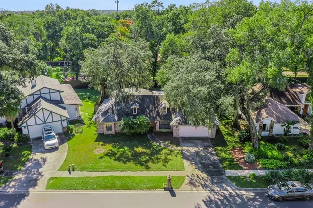 an aerial view of a house with a garden