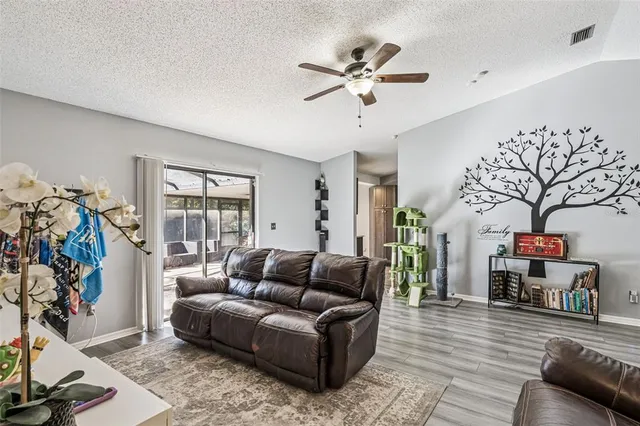 a living room with furniture and a large window