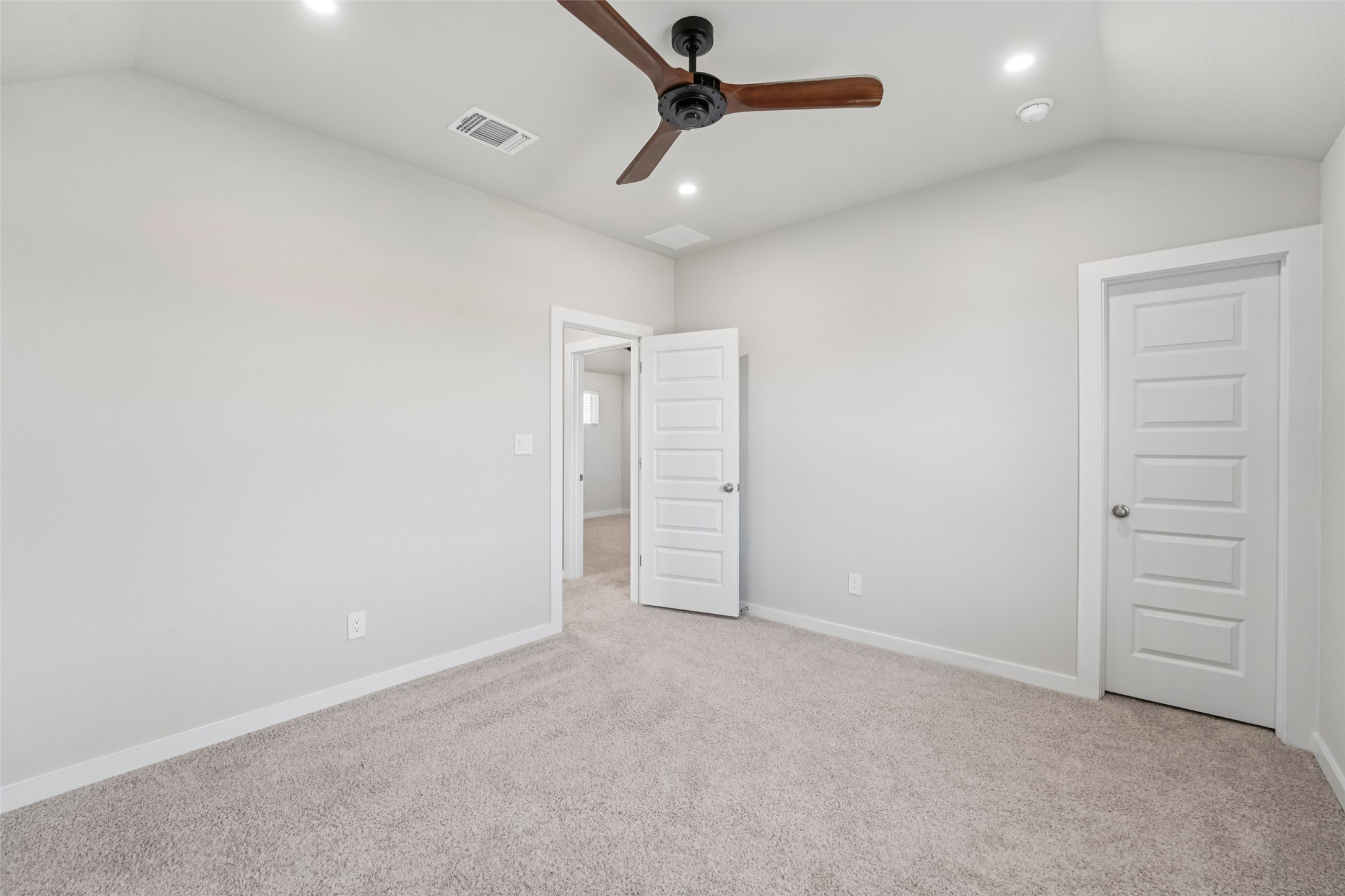 1108 Sweetspire Street Leander, TX 78641 - Photo 31 of 39 Unfurnished bedroom featuring lofted ceiling, light colored carpet, recessed lighting, and ceiling fan