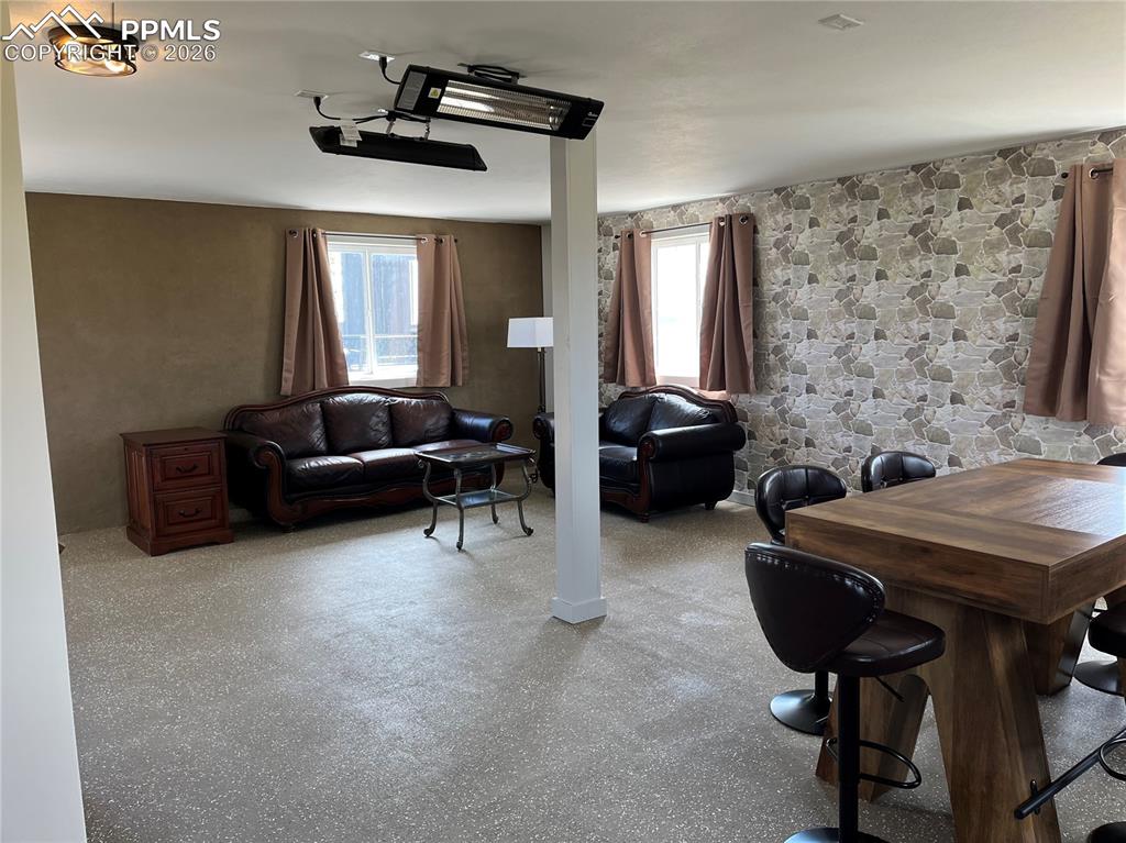 136 Black Knat Road Fairplay, CO 80440 - Photo 24 of 38 a living room with furniture and a chandelier
