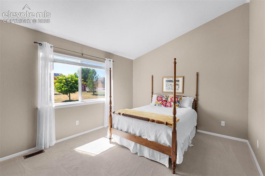 7840 Midnight Road Peyton, CO 80831 - Photo 21 of 48 A vaulted ceiling, large window and great wall space for even large furniture