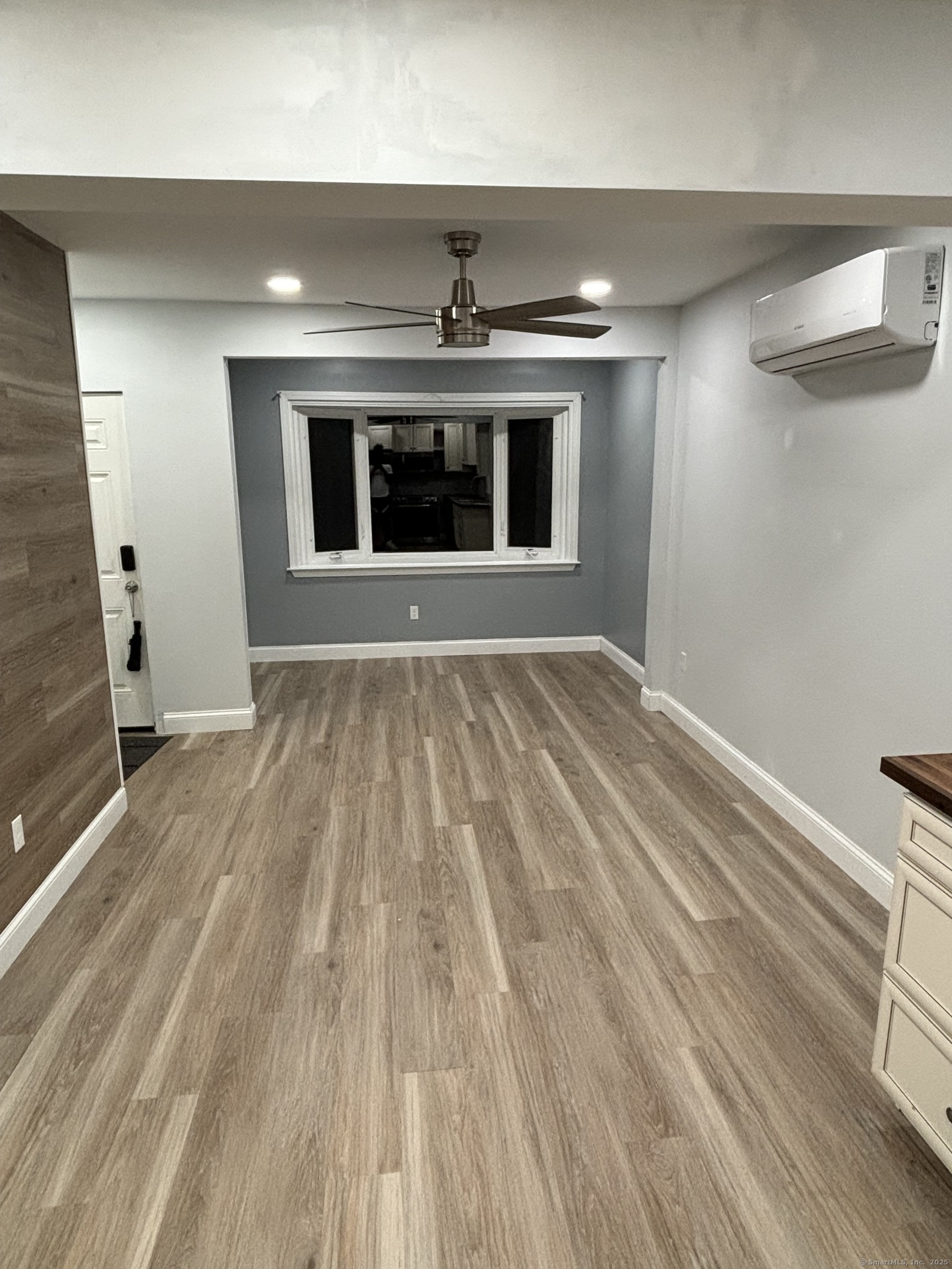171 Moreland Avenue, Unit 1 Waterbury, CT 06705 - Photo 3 of 10 a view of an empty room with a fireplace