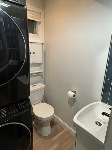 a bathroom with a toilet and a sink
