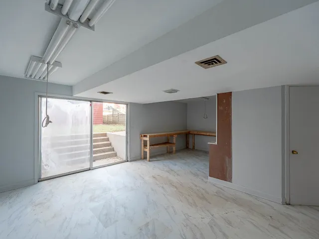 a bathroom with a granite countertop sink and vanity