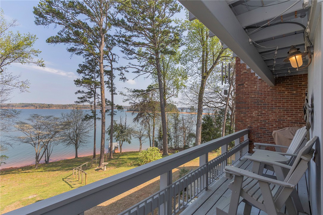 7 Harbor Gate, Unit 7 BUILDING 2 Anderson, SC 29625 - Photo 1 of 47 Enjoy tranquil water views from this expansive deck, perfect for peaceful mornings and serene evenings.