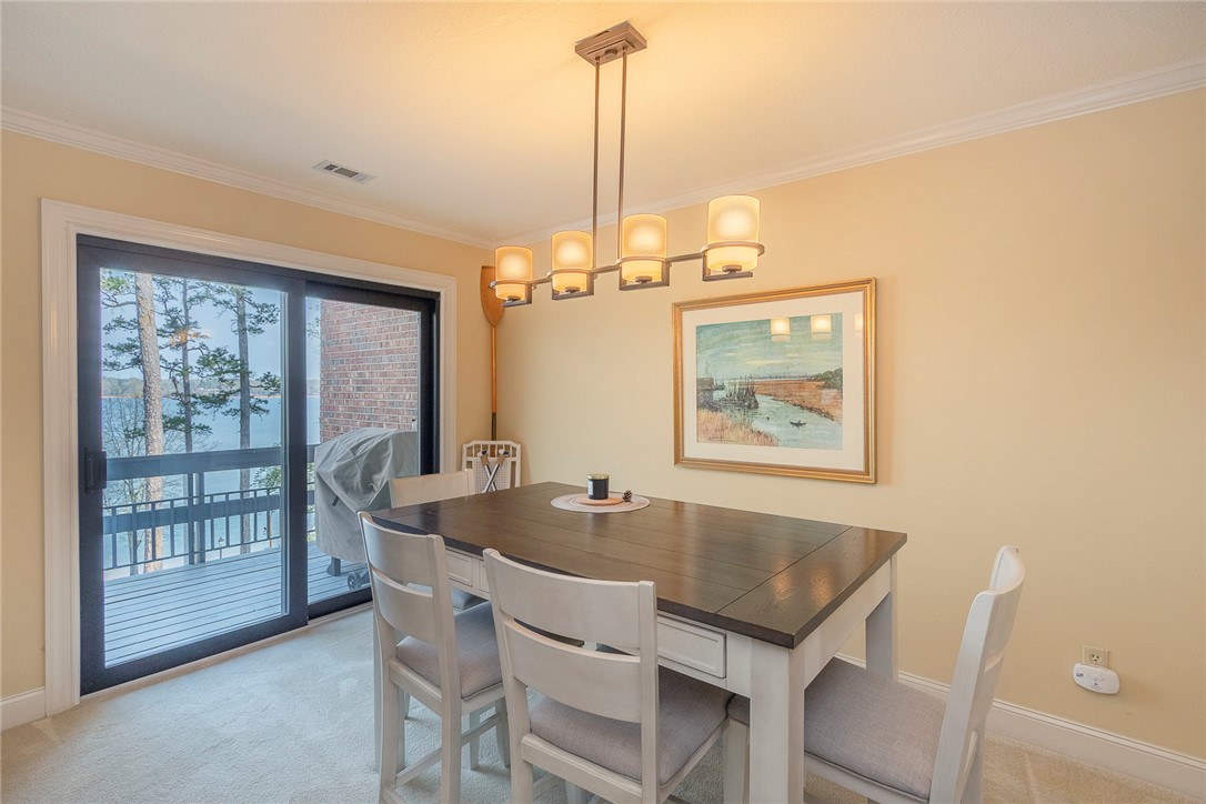 7 Harbor Gate, Unit 7 BUILDING 2 Anderson, SC 29625 - Photo 14 of 47 This dining area offers scenic water views, perfect for peaceful meals.