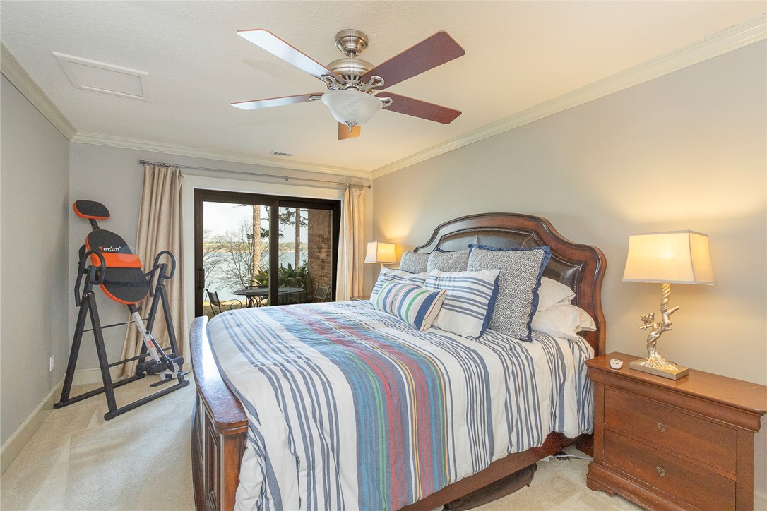 7 Harbor Gate, Unit 7 BUILDING 2 Anderson, SC 29625 - Photo 26 of 47 This peaceful bedroom offers a private patio with tranquil waterfront views.