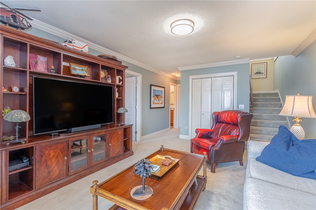 7 Harbor Gate, Unit 7 BUILDING 2 Anderson, SC 29625 - Photo 27 of 47 This living area features a built-in entertainment center, providing both style and practicality.