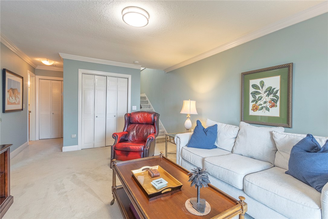 7 Harbor Gate, Unit 7 BUILDING 2 Anderson, SC 29625 - Photo 28 of 47 This inviting living room features soft carpeted flooring, perfect for relaxation and comfort.