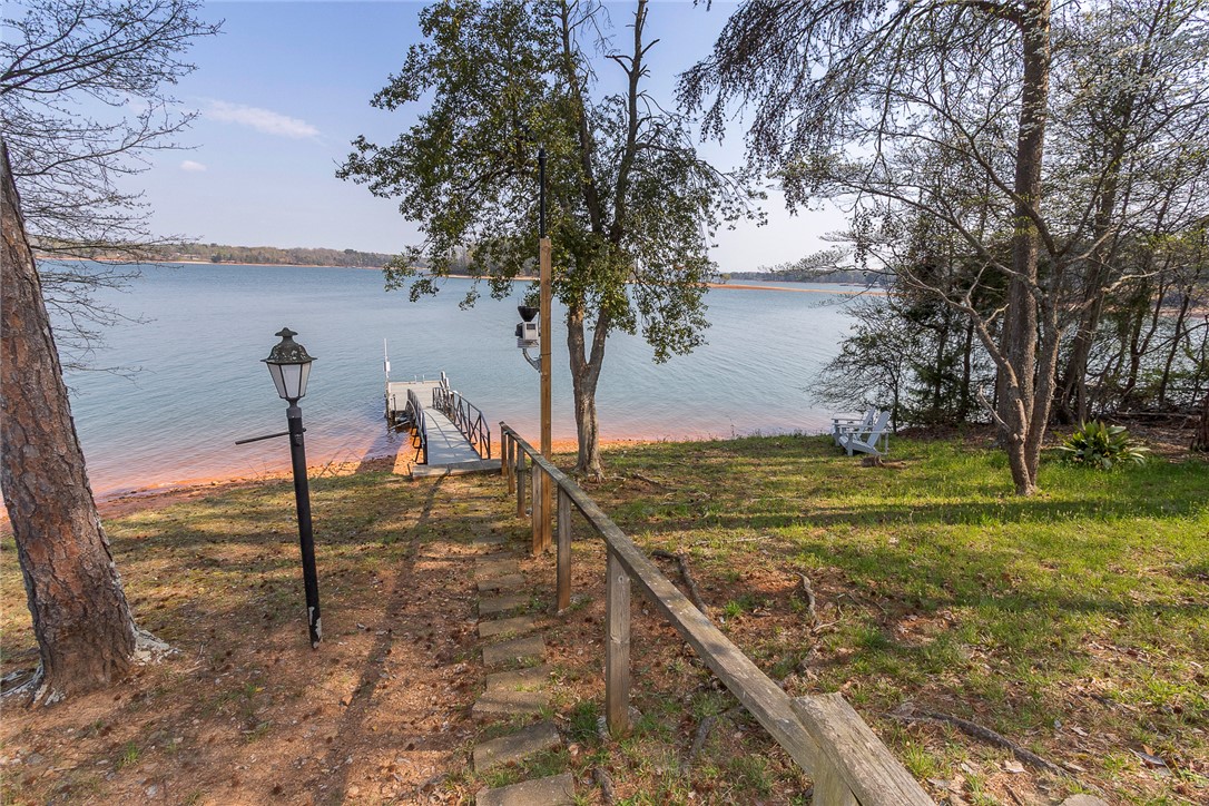 7 Harbor Gate, Unit 7 BUILDING 2 Anderson, SC 29625 - Photo 36 of 47 This serene waterfront property features a private dock, offering direct access to the expansive lake.