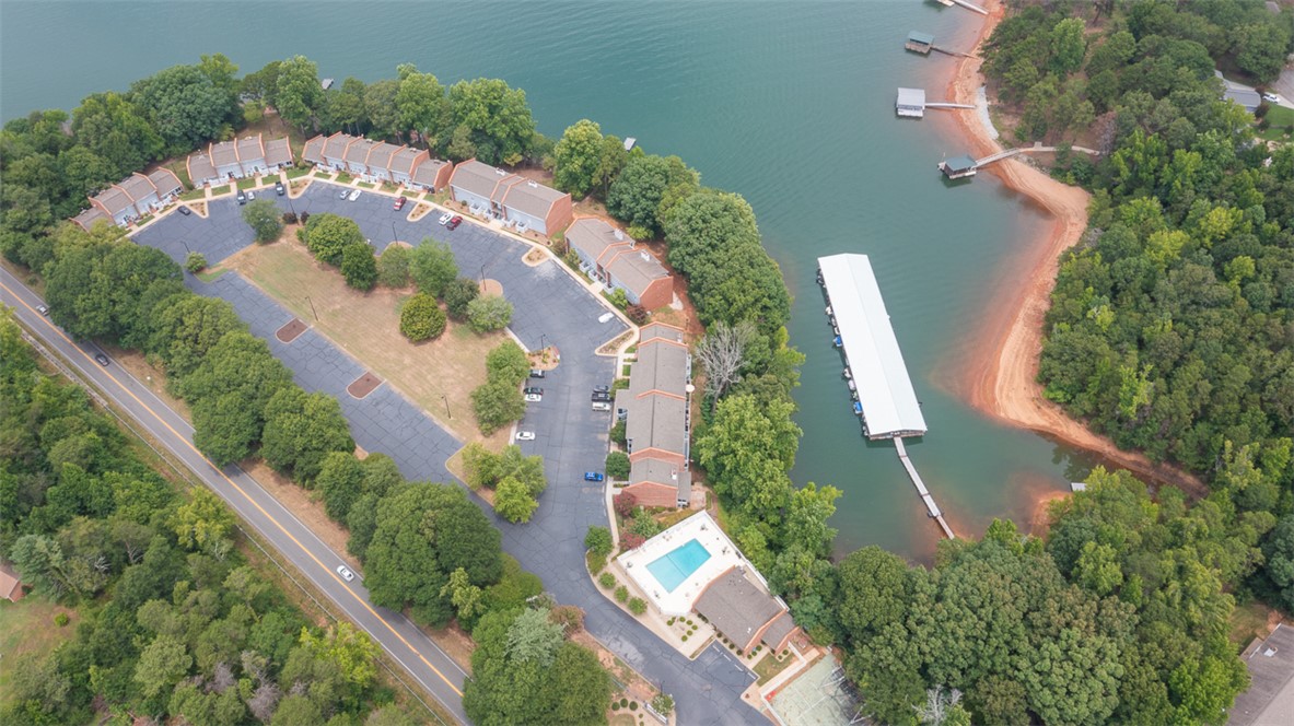 7 Harbor Gate, Unit 7 BUILDING 2 Anderson, SC 29625 - Photo 44 of 47 This aerial view showcases a vibrant community with lakefront access, ample parking, and recreational amenities.