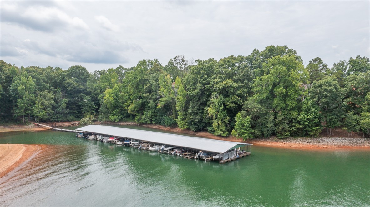 7 Harbor Gate, Unit 7 BUILDING 2 Anderson, SC 29625 - Photo 45 of 47 Boasting a covered boat dock, this property offers direct waterfront access.