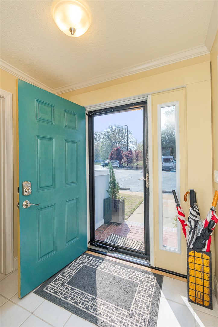 7 Harbor Gate, Unit 7 BUILDING 2 Anderson, SC 29625 - Photo 5 of 47 This inviting entrance features a vibrant front door and sunlit entryway, creating a warm welcome.