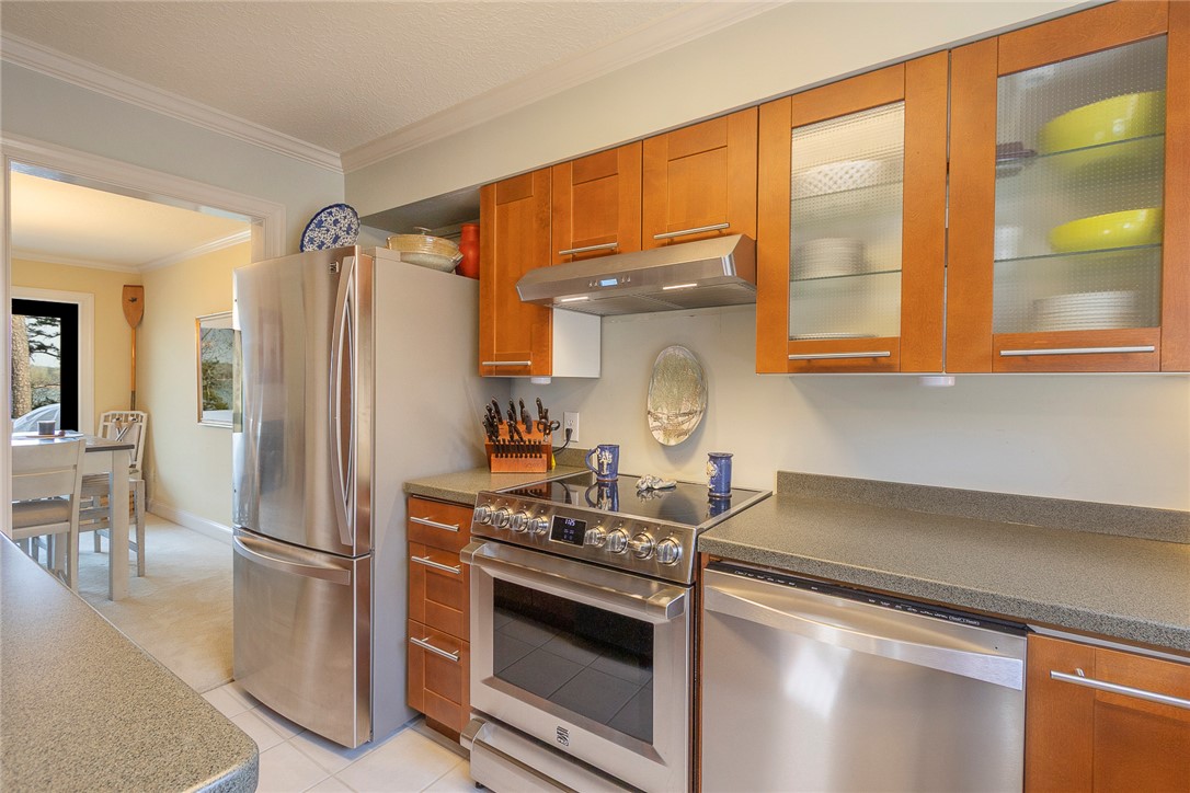 7 Harbor Gate, Unit 7 BUILDING 2 Anderson, SC 29625 - Photo 8 of 47 This modern kitchen features stainless steel appliances and sleek cabinetry, offering both style and functionality.