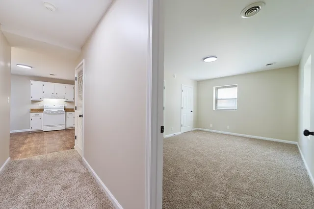 a view of a bathroom with a sink and a mirror